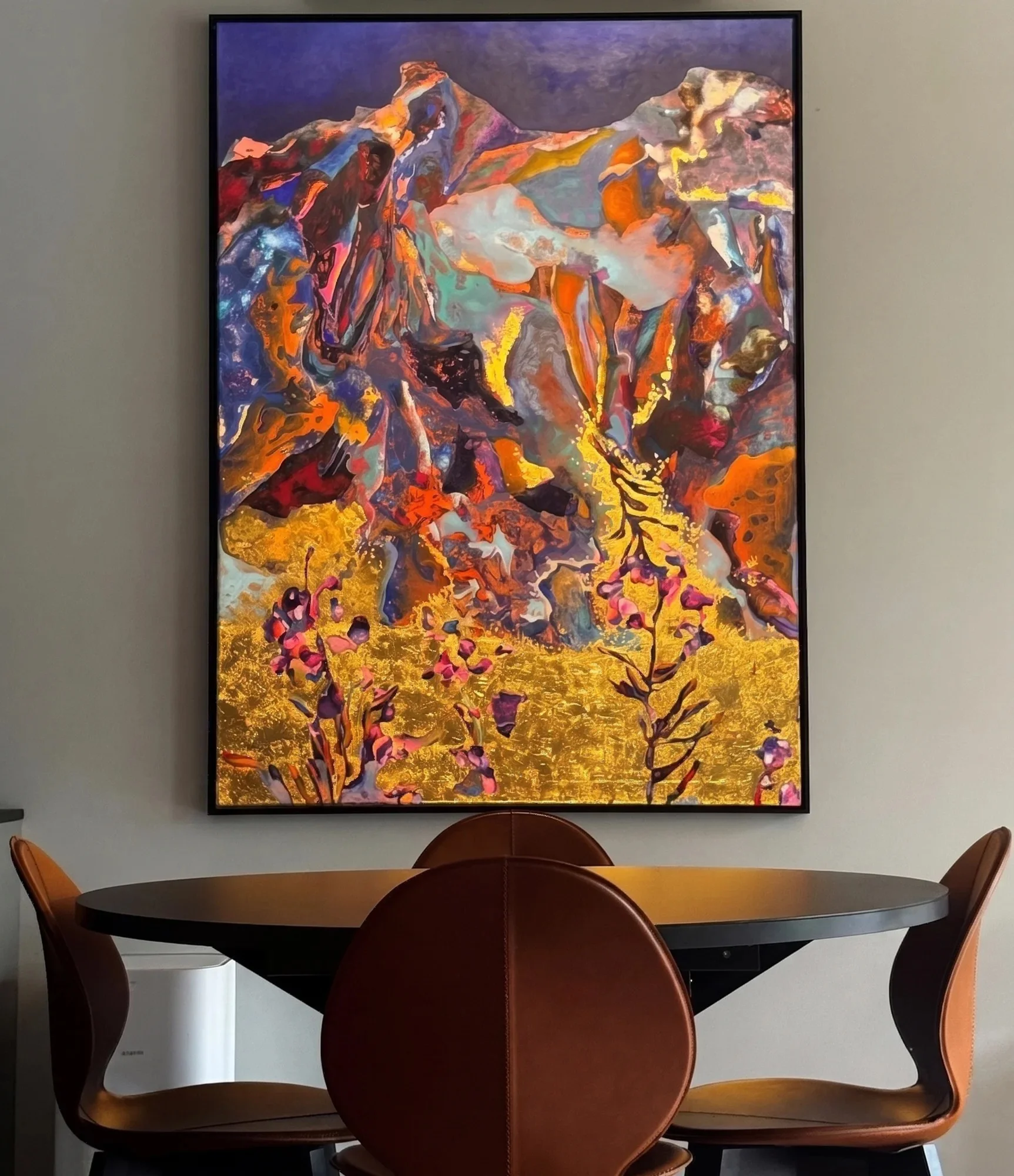 Original painting with gold leaf, mountain landscape, above a dining table